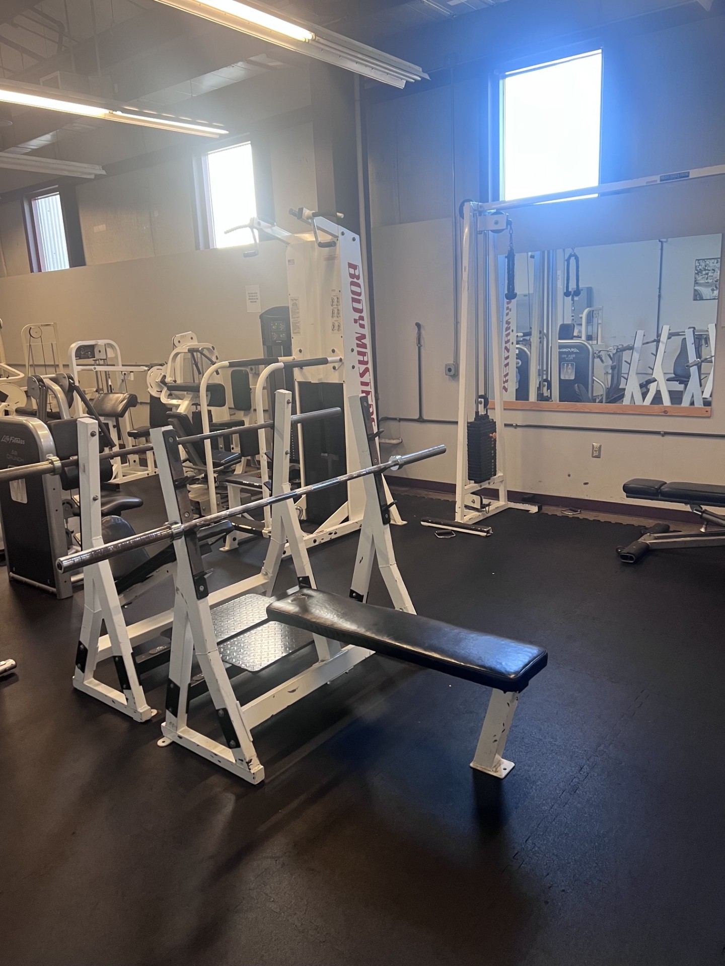 TK Fitness free weight and bench area